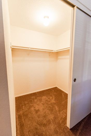 a empty bathroom with a closet and a door  at The Lodge at Madrona, Washington